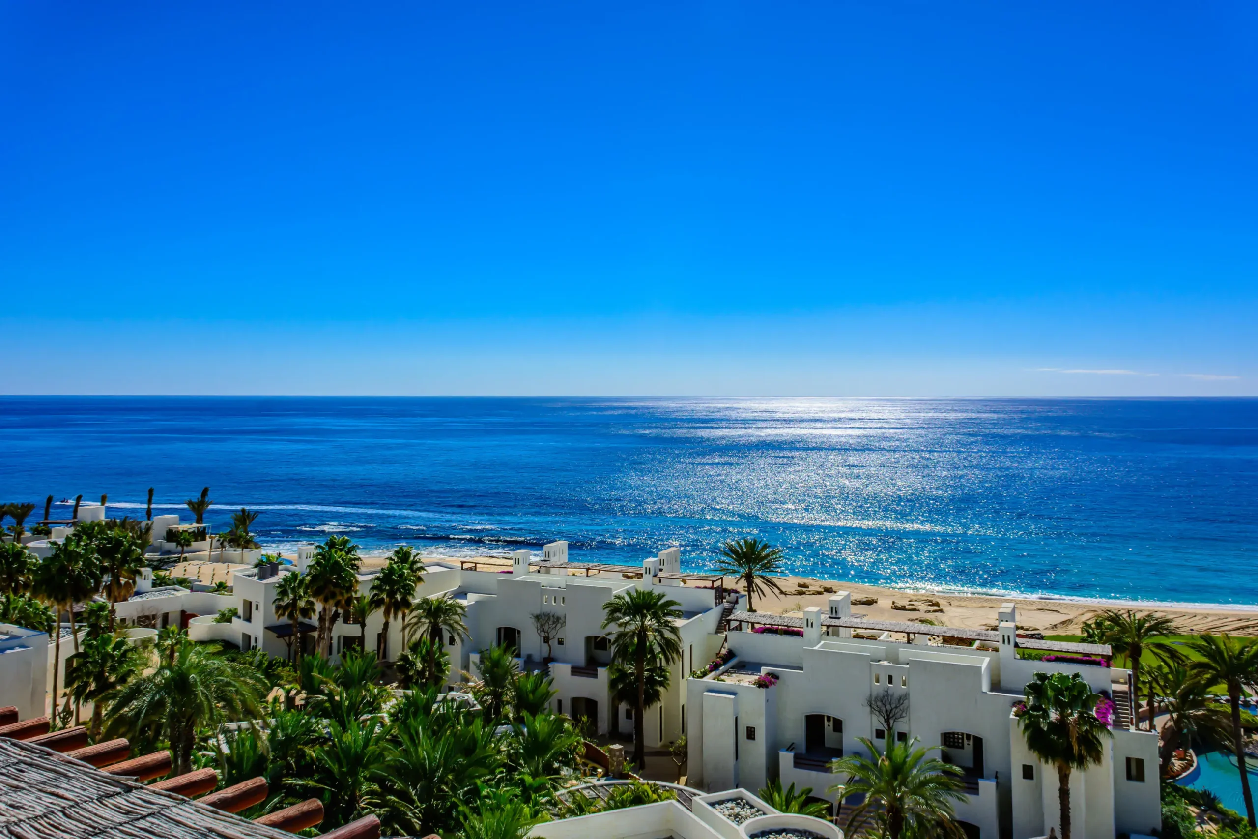 Luxury Cabo real estate homes for sale showcasing hillside estates with panoramic ocean views