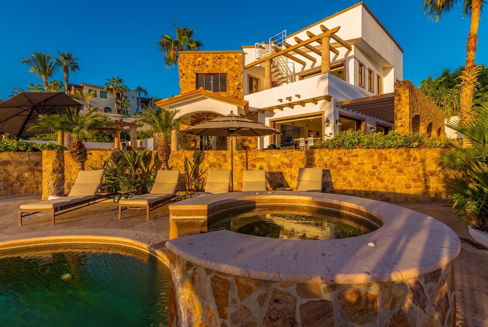 Los Cabos Cresta Del Mar Mediterranean-style Home with a poolside bar and generously proportioned patio with its water features, putting green, pool and spa create a playful inviting atmosphere where friends and family will want to gather. Sunset cocktails atop the rooftop deck with its arch for sale