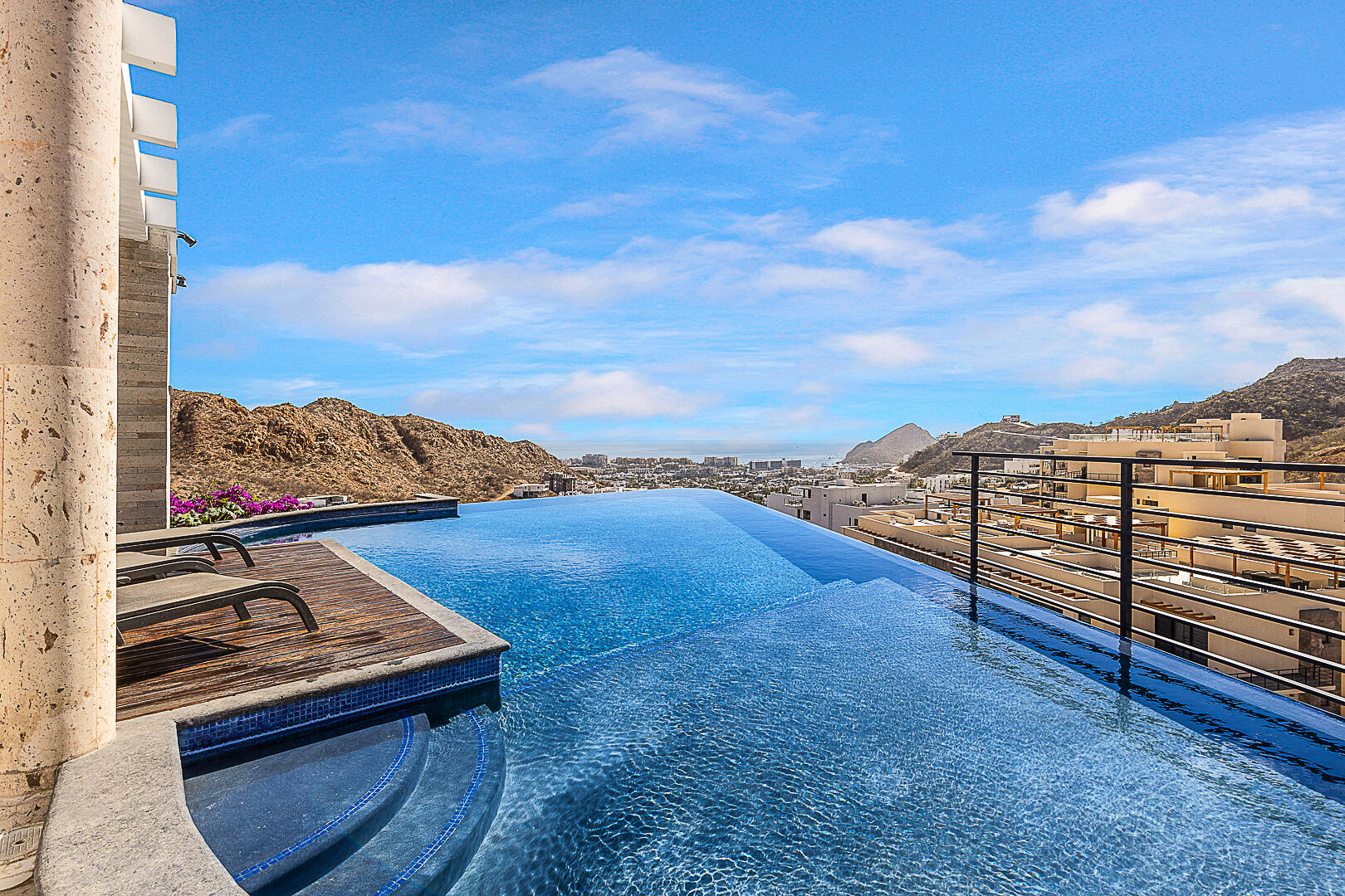 Los Cabos Villa La Estancia Luxurious 2-bedroom, 3-bath full-ownership residence located within one of only two beachfront resorts on Medano Beach in Cabo San Lucas. This spacious unit features a fully equipped kitchen with stainless steel appliances and pantry, opening to a comfortable living and dining area. The expansive primary suite offers a king bed, sitting area, workspace, and spa-style bath with Jacuzzi tub, walk-in shower, and double vanity. Guest bedroom includes two queen beds and en-suite bath. Both bedrooms and living area open to a large terrace with garden and ocean for sale