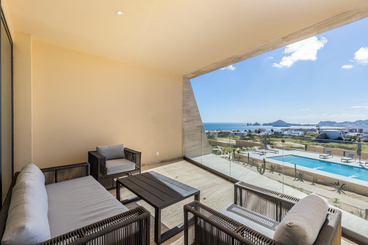 Los Cabos Villa La Estancia Luxurious 2-bedroom, 3-bath full-ownership residence located within one of only two beachfront resorts on Medano Beach in Cabo San Lucas. This spacious unit features a fully equipped kitchen with stainless steel appliances and pantry, opening to a comfortable living and dining area. The expansive primary suite offers a king bed, sitting area, workspace, and spa-style bath with Jacuzzi tub, walk-in shower, and double vanity. Guest bedroom includes two queen beds and en-suite bath. Both bedrooms and living area open to a large terrace with garden and ocean for sale