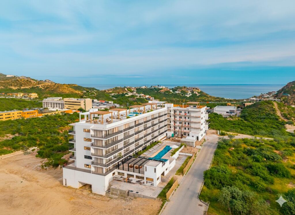 Los Cabos Morgan Residences Furnished 2-bedroom, 2-bath condominium in Morgan Residences — 94.50 m² (≈1,016 ft²) interior plus balcony; located on the 2nd floor of a six-story boutique building with 54 units. This lock-off condo offers flexible living: enjoy as a spacious full residence or divide into two separate 1-bedroom units for dual rental income or personal use. Includes one dedicated parking space located directly behind the unit. Just minutes from downtown Cabo's Marina, Medano Beach and the best restaurants — an ideal investment for long-term rental, vacation rental or a second home. This well-appointed condo in Morgan Residences presents a rare opportunity for versatility and convenience in Cabo San Lucas. With two full bathrooms and two bedrooms, plus a lock-off design, you have the flexibility to live in one unit and rent the other or maximize income by renting both. The residence is sold fully furnished and turnkey, so it's ready for immediate use or rental. A private parking space is included, located conveniently behind the unit a notable benefit given limited parking options in downtown Cabo.Residents at Morgan enjoy access to boutique-style amenities including a rooftop pool with ocean and city – Colorado Hills #305B, San Jose Corridor, San Jose Corridor, BS