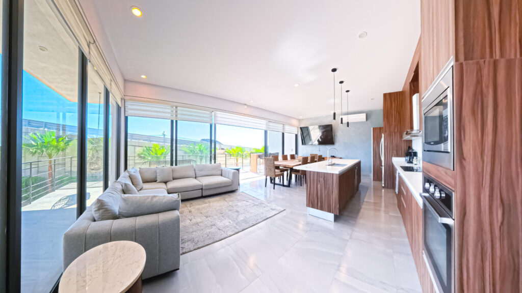 Los Cabos El Tezal E;General Unit 104 at Torre Catalina, an elegant condominium in the desirable El Tezal area of Cabo San Lucas. This thoughtfully laid-out residence provides 134.70 m² of interior air-conditioned area and an additional 20 m² private terrace, ideal for alfresco dining, morning coffee, or evening sunsets.The open living area flows to the terrace, creating seamless indoor/outdoor living. The kitchen is designed for both daily use and entertaining; bedrooms are generously sized and benefit from natural light and privacy. Practical features include assigned parking, secure building access, and in-unit storage. Location is convenient to Cabo's shops, dining and beaches. – Lote 01 Manzana 07, Cabo Corridor, BS