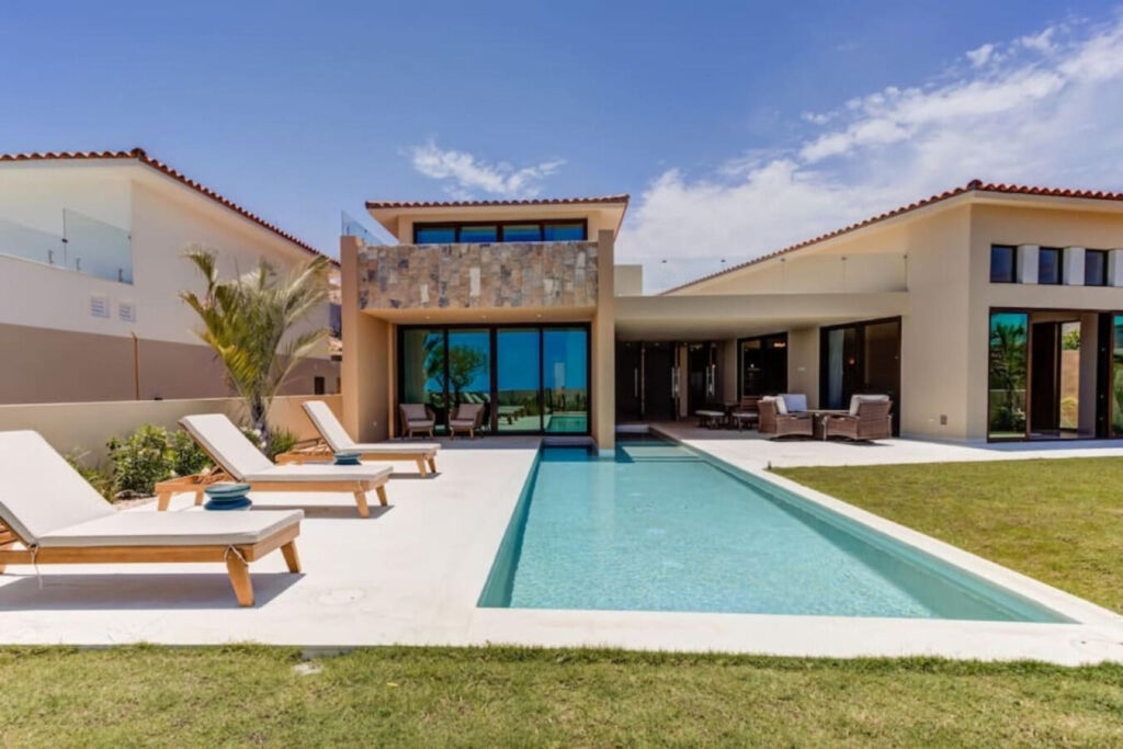 Los Cabos Vista Lagos Stunning fully furnished 3BR villa + service room (considered as the 4th bedroom) in exclusive Club Campestre. Enjoy a heated pool, jacuzzi, and stylish outdoor areas. The primary suite features a private terrace, jacuzzi, spa space, and walk-in closet. Two guest bedrooms with ensuite baths and a versatile service room add comfort. Open-concept kitchen, dining for 8, fire pit, and grill make it ideal for entertaining. Lot size: 9,972 sq ft. Just 15 min from downtown San José del Cabo, near golf, beaches, top restaurants, shopping, hospitals, and schools. Gated community with 24/7 security. Located within the prestigious gates of Club Campestre, Vista Lago 26 is more than a homeit's a refined expression of Los Cabos living. With nearly 10,000 sq ft of land, this villa offers generous space, architectural elegance, and a seamless indoor-outdoor flow designed for both quiet moments and memorable gatherings.This home stands out not only for its layout and finishes but for the ease of living it offers. From the heated pool and private jacuzzi to the fully equipped kitchen and fire pit lounge, every detail was conceived to elevate comfort and connection. Whether hosting family, friends, or guests, the design allows everyone to enjoy privacy and togetherness in equal measure.Beyond the walls of the home, Club Campestre itself becomes an extension of your lifestyle. The community is known for its discreet luxury, sense of calm, and exceptional amenities: an 18-hole Jack Nicklaus Signature golf course, private beach club (optional membership), and a strong sense of neighborhood securitythanks to 24/7 controlled access.But what truly sets this location apart is proximity. In just a few minutes, you can access:The golden sands of Palmilla, Costa Azul and Cabo Surf (ideal for swimming or surfing)Upper Scale supermarkets (La Comer, Chedraui Selecto)Leading hospitals and bilingual private schoolsDowntown San José del Cabo, full of culture, art, and historic charmIf you're an investor, the home's potential as a luxury short-term rental is immediate. The combination of size, amenities, location, and style make it highly attractive to discerning travelers looking for private, secure accommodations with resort-level experiences. If you're a full-time resident or digital nomad, you'll appreciate the stable infrastructure, fiber optic internet, nearby medical support, and ease of access to both San José and Cabo San Lucas via the Transpeninsular Highway (just 100 meters away).The home has also been carefully maintained, is sold fully furnished, and includes modern appliances and home systemsmaking your transition seamless from day one.In summary: Vista Lago 26 is turnkey luxury with long-term value. Whether you're looking to invest, relocate, or upgrade your lifestyle, this home delivers Cabo's promise of sun, space, and soulbeautifully. – Lote 26 Vista Lago, San Jose del Cabo, BS