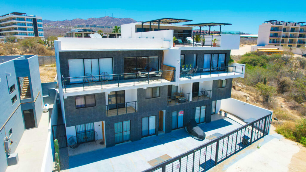 Los Cabos Morgan Residences Furnished 2-bedroom, 2-bath condominium in Morgan Residences — 94.50 m² (≈1,016 ft²) interior plus balcony; located on the 2nd floor of a six-story boutique building with 54 units. This lock-off condo offers flexible living: enjoy as a spacious full residence or divide into two separate 1-bedroom units for dual rental income or personal use. Includes one dedicated parking space located directly behind the unit. Just minutes from downtown Cabo's Marina, Medano Beach and the best restaurants — an ideal investment for long-term rental, vacation rental or a second home. This well-appointed condo in Morgan Residences presents a rare opportunity for versatility and convenience in Cabo San Lucas. With two full bathrooms and two bedrooms, plus a lock-off design, you have the flexibility to live in one unit and rent the other or maximize income by renting both. The residence is sold fully furnished and turnkey, so it's ready for immediate use or rental. A private parking space is included, located conveniently behind the unit a notable benefit given limited parking options in downtown Cabo.Residents at Morgan enjoy access to boutique-style amenities including a rooftop pool with ocean and city – PH BETANYA, Cabo Corridor, Cabo Corridor, BS
