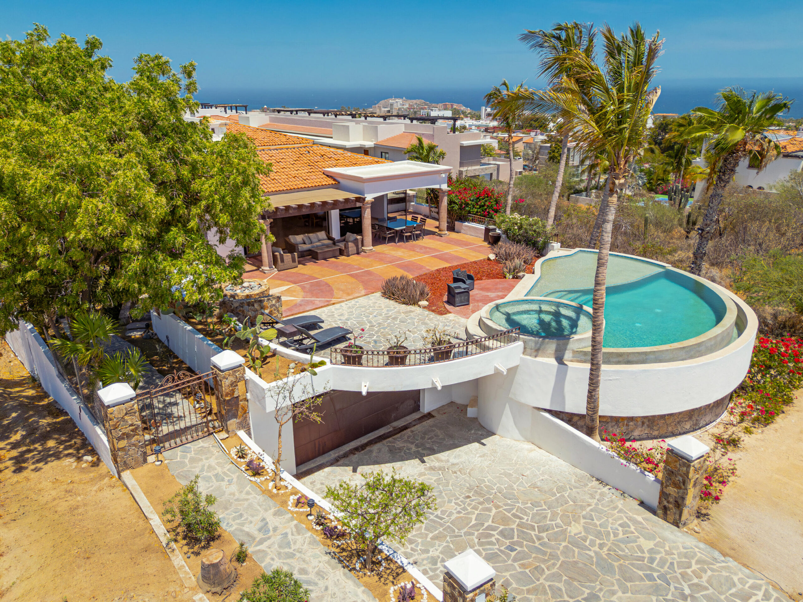 Los Cabos Rancho Paraiso Ests Casa Sol is a pristine, recently completed luxury residence (April 2025) that offers the perfect blend of modern design and estate-sized privacy offering 306.42 square meters of total construction set on an exceptional 1,266.195 square meter lot, a rare feature that immediately sets this property apart within Rancho Paraíso. The interior features 3 spacious bedrooms, 3.5 bathrooms, and a private office. The expansive lot provides a true estate-like feel, delivering space, privacy, and long-term value that is increasingly difficult to find in newer luxury homes. The size of the lot allows for wide separation from neighboring residences, generous setbacks, and beautifully scaled outdoor living areas. It creates an open, airy environment where natural light, ocean breezes, an An empty lot below the property is subject to height restrictions, helping preserve for sale