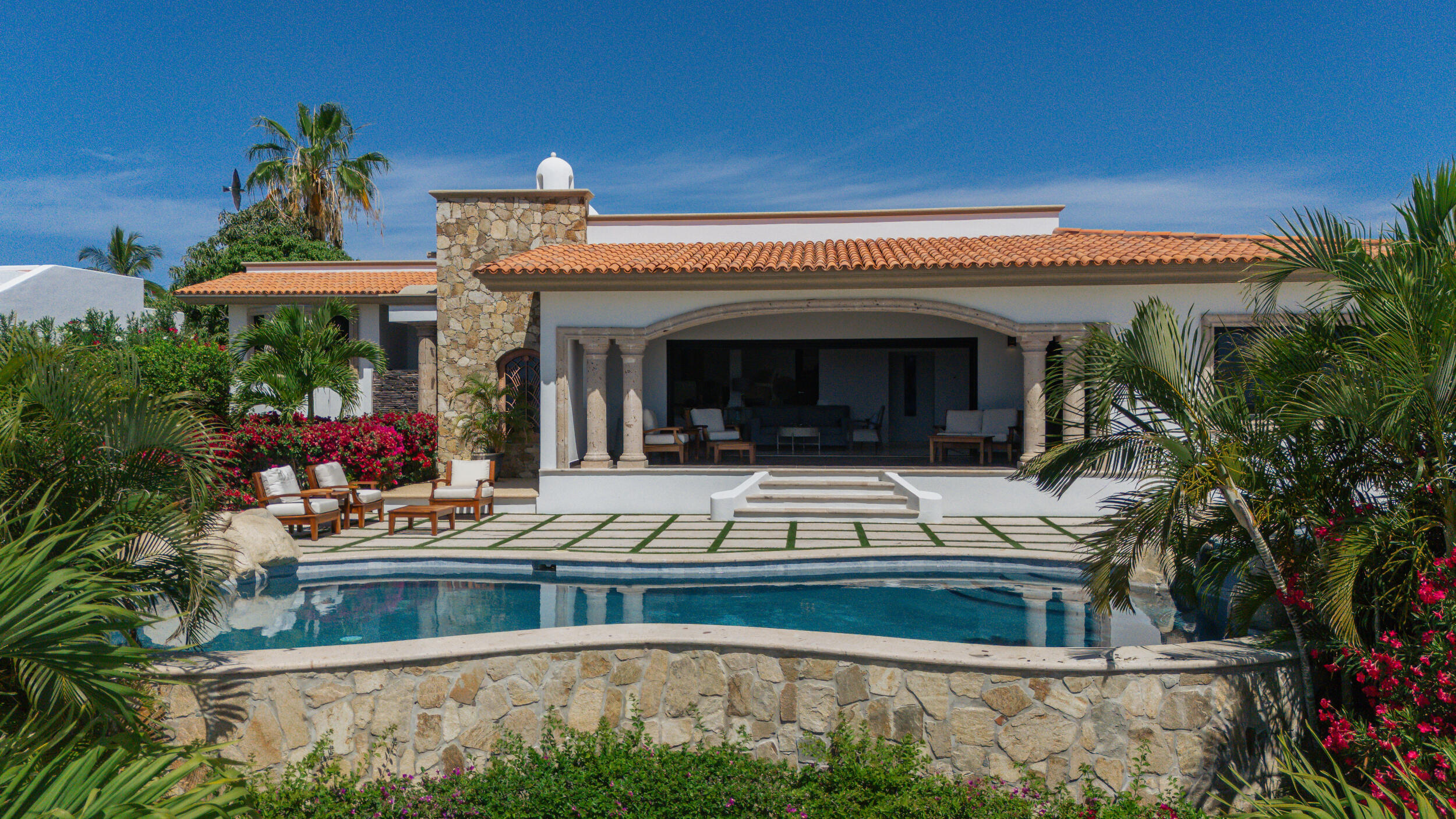 Los Cabos Rancho Paraiso Ests Casa Sol is a pristine, recently completed luxury residence (April 2025) that offers the perfect blend of modern design and estate-sized privacy offering 306.42 square meters of total construction set on an exceptional 1,266.195 square meter lot, a rare feature that immediately sets this property apart within Rancho Paraíso. The interior features 3 spacious bedrooms, 3.5 bathrooms, and a private office. The expansive lot provides a true estate-like feel, delivering space, privacy, and long-term value that is increasingly difficult to find in newer luxury homes. The size of the lot allows for wide separation from neighboring residences, generous setbacks, and beautifully scaled outdoor living areas. It creates an open, airy environment where natural light, ocean breezes, an An empty lot below the property is subject to height restrictions, helping preserve for sale