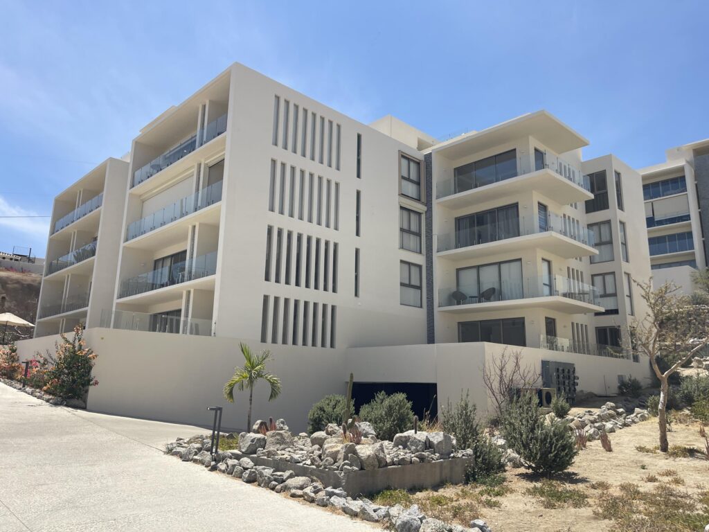 Los Cabos Cabo Costa POOL INCLUDED! This stunning 2-bedroom condo with huge deck is located on the first level in the Balandra Tower of Cabo Costa . Cabo Costa is the newest community that blends its arquitectural designs with nature. This unit has been meticulously designed and comprises two end-suite bedrooms. The property interior is designed in neutral tones to create a modern, welcoming and luxurious home yet retaining its original features. Amenities such as a Club House, Infinity pool, Gym, sundeck, Kids area, Jacuzzi, Wetbar, Snackbar & Massage area. – Oasis San José, San Jose del Cabo, San Jose del Cabo, BS